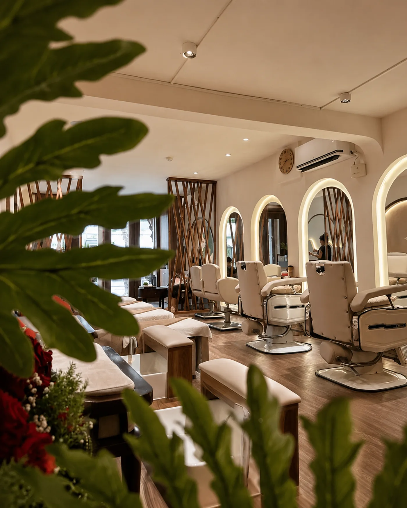 Salon styling chairs beneath arched mirrors, ready for guests