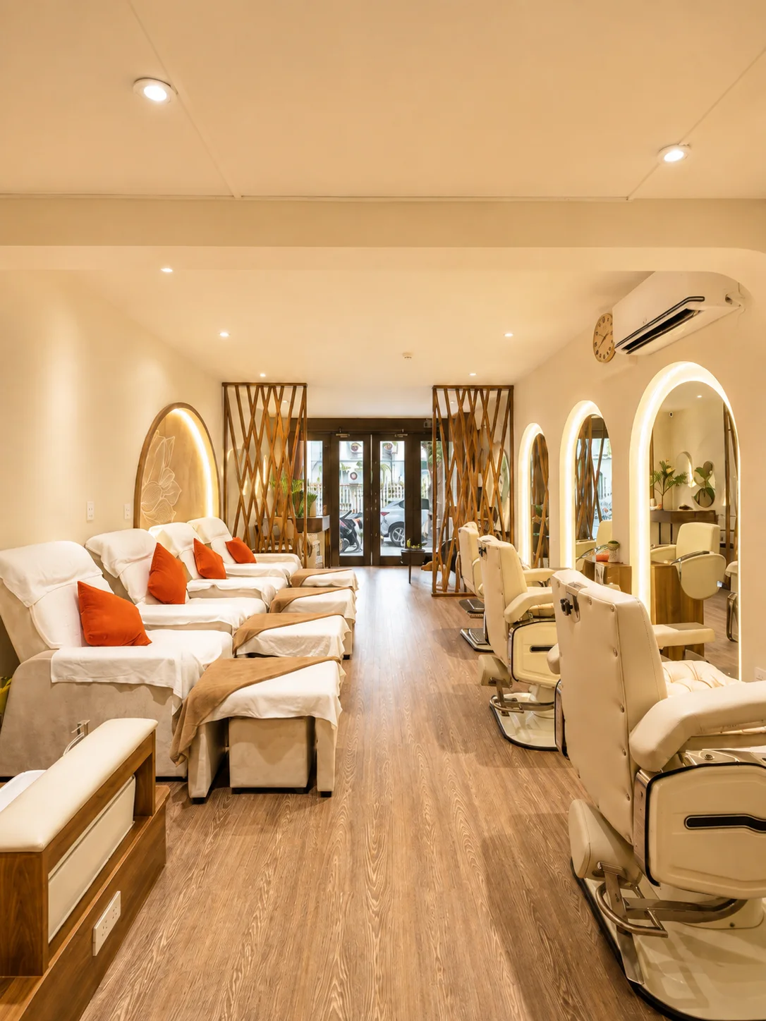 Wide view of the pedicure lounge and styling chairs leading to the entrance